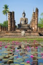 Statue of the sitting Buddha on ruins of the Wat Chana Songkram temple. Sukhothai, Thailand Royalty Free Stock Photo