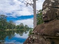 A statue on the south gate at Angkor Thom Royalty Free Stock Photo