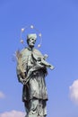 Statue of St John Nepomucene with crucifix in hand, Charles Bridge, Prague, Czech Republic