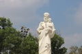 Statue of St. Joseph with trees and blue sky background in philomena church in mysore