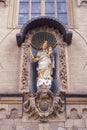 Statue of St. Mary with child, St. Mary is crowned and holds a sceptre, Jesus has an orb in his left hand.