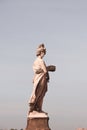 Statue of Summer overlooking the Arno River at the Ponte Santa Trinita bridge in Florence, Italy Royalty Free Stock Photo