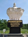 A statue of a tea garden worker at the entrance of Srimangal