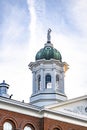 Statue of Themis with scales in her hand on the dome of a building in New England Royalty Free Stock Photo