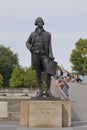 Statue of Thomas Jefferson, by JeanCardot shows him holdingarchitectural drawings of Monticello as he looks at inspiration Hotel