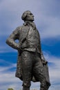 Statue of Thomas Jefferson, by JeanCardot shows him holdingarchitectural drawings of Monticello as he looks at inspiration Hotel