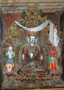 Statue of a Tibetan deity with a silvery body in a monastery