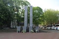 Statue to remember the victems of world war 2 in The hague with flowers of the remembarance activity