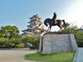 Statue of Todo Takatora and Imabari Castle. Royalty Free Stock Photo