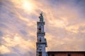 Statue on top of facade of Chiesa di San Michele in Foro St Michael Roman Catholic church in historical centre of old medieval tow