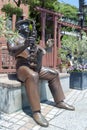 Statue of trumpet player in front of Weathercock House in historic area of Kitano district in Kobe, Japan Royalty Free Stock Photo