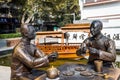 Statue of two Chinese young man drinking tea together on the bank of Qinhuai River, Nanjing, China