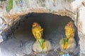 Statue of two ladies named Tapao Kaew and Tapao Thong in the Chalawan cave (Thai folktale), located at Wat Mahathat temple, Phichi