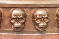 Statue of two skulls on the walls.