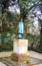 Dachau, Upper Bavaria / Germany - March 2018: A statue of an unknown prisioner stands among the trees at the Dachau Concentration