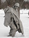 Statue of US Army soldier trudging through snow covered ground at the Korean War Memorial in Washington DC Royalty Free Stock Photo