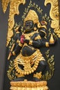 Statue of Vajrapani Maha Bodhisattva statue at a temple in Thailand.