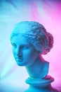 Statue of Venus de Milo. Creative concept colorful neon image with ancient greek sculpture Venus or Aphrodite head Royalty Free Stock Photo