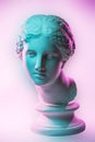 Statue of Venus de Milo. Creative concept colorful neon image with ancient greek sculpture Venus or Aphrodite head Royalty Free Stock Photo