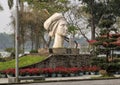 The statue of a Vietnamese girl, sculpted by Le Thanh Nhon, located in Hue along the Parfume River.