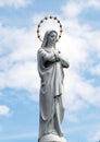 Statue of Virgin Mary as a symbol of love and kindness near catholic church. Royalty Free Stock Photo