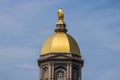 Notre Dame - Circa August 2018: Statue of Mary atop the Golden Dome of the University of Notre Dame Main Administration Building