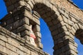 Statue of Virgin Mary and baby Jesus on Roman water aqueduct, Segovia, Spain