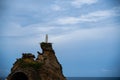 Statue of the Virgin Mary in Biarritz Spain against the blue sky and the calm sea Royalty Free Stock Photo