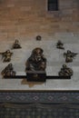 Statue of Virgin Mary with a child Jesus Christ on the wall of the cathedral behind the altar.