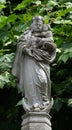 The statue of the Virgin Mary with the child Jesus in the courtyard of the church of St. Leodegar in Lucerne Royalty Free Stock Photo