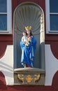 Statue of Virgin Mary with child Jesus at an old half-timbered h Royalty Free Stock Photo