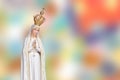 Statue virgin Mary Fatima of the Catholic Church on blur colorful background Royalty Free Stock Photo