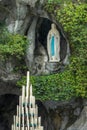 Statue of Virgin Mary in the grotto of Our Lady of Lourdes France Royalty Free Stock Photo