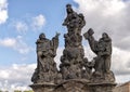 Statue with Virgin Mary and the infant Jesus, Saint Dominic, and Saint Thomas Aquinas, on the Charles Bridge, Prague Royalty Free Stock Photo