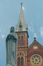 Statue of the Virgin Mary at the Notre-Dame Cathedral Basilica of Saigon, Vietnam. Exterior view. Royalty Free Stock Photo