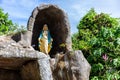 Statue of Virgin Mary in a rock cave chapel outside the St AnneÃ¢â¬â¢s Catholic Church in Baie Ste Anne, Praslin Royalty Free Stock Photo