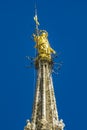 Statue of the Virgin Mary on top of Milan Cathedral Duomo di Milano in Italy Royalty Free Stock Photo