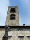 Statue of the Virtue in front of the tower of the Civica to Bergamo in Italy,