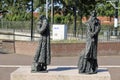 Statue Wachtende Rijzigers (Passengers waiting) at station of Waddinxveen