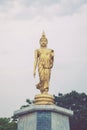 Statue of walking Buddha enshrined at Bung Phalanchai Lake, Roi Et Province, northeastern Thailand