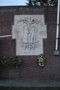 Statue on the wall named `Zij waren eensgezind ` on the outside of the prison Scheveningen Royalty Free Stock Photo