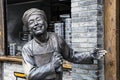 Statue welcoming tourists into restaurant along Kuanzhai Alleys,