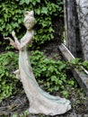 A statue of a white fairy found in an Abandoned Garden