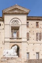 The statue of a white lion in the historic center of Soragna, Parma, Italy