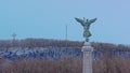 Statue winged Goddess of Liberty in front of Mont Royal with cross and radio mast , Montreal