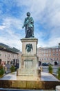 Statue of Wolfgang Amadeus Mozart on Mozartplatz or Mozart Square in old city of Salzburg. Austria Royalty Free Stock Photo
