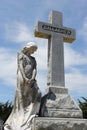 Statue of Woman and Cross