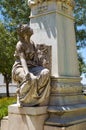 Statue of woman in front of the bust of Dr. Barahona in the Garden of Diana. Evora. Portugal Royalty Free Stock Photo