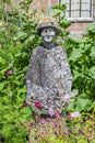 Statue of a woman in the garden Royalty Free Stock Photo