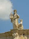 Statue of a woman holding a lantern, detail of the medieval city gate f Alba Iulia